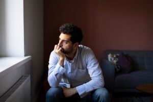 Man sitting alone and overthinking 